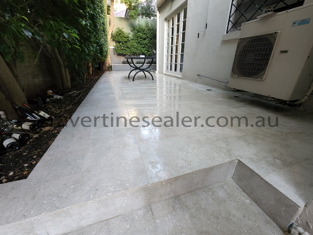  Cambridge A man cleans a beautiful travertine floor using advanced machine