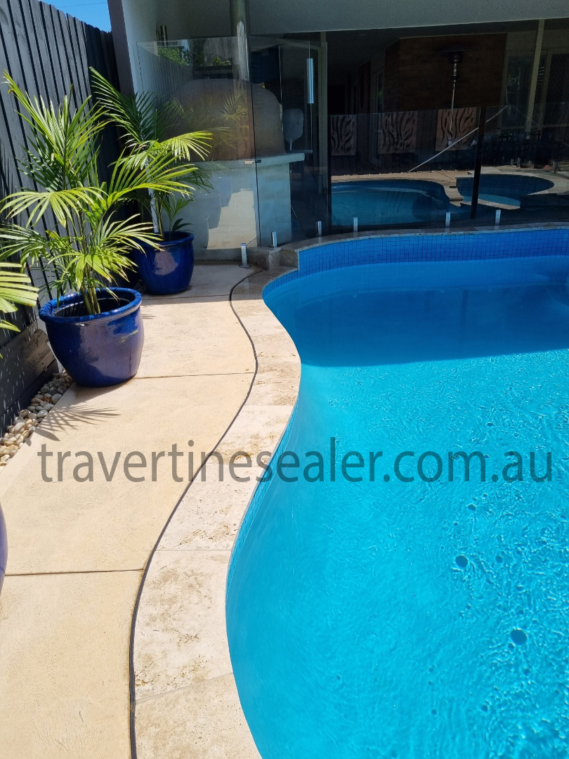 outdoor travertine tile-floor-around-pool